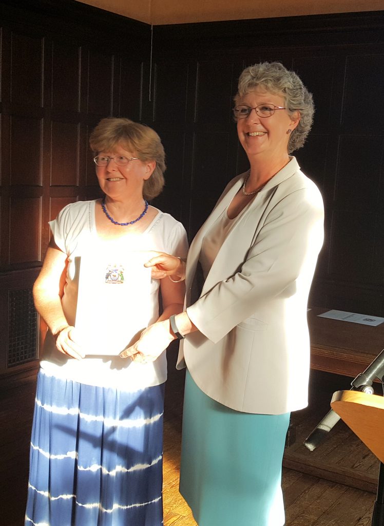 Judy Webb receiving her Certificate of Honour